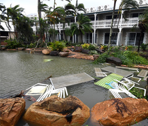 Authorities say to place your outdoor plastic furniture into the swimming pool during high winds. The owners of this hotel in Airlie Beach took that advice and minimised the damage from wind-borne flying furniture